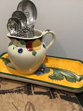 Vintage creamer metal measuring spoons set on Unbranded colorful studio ceramic